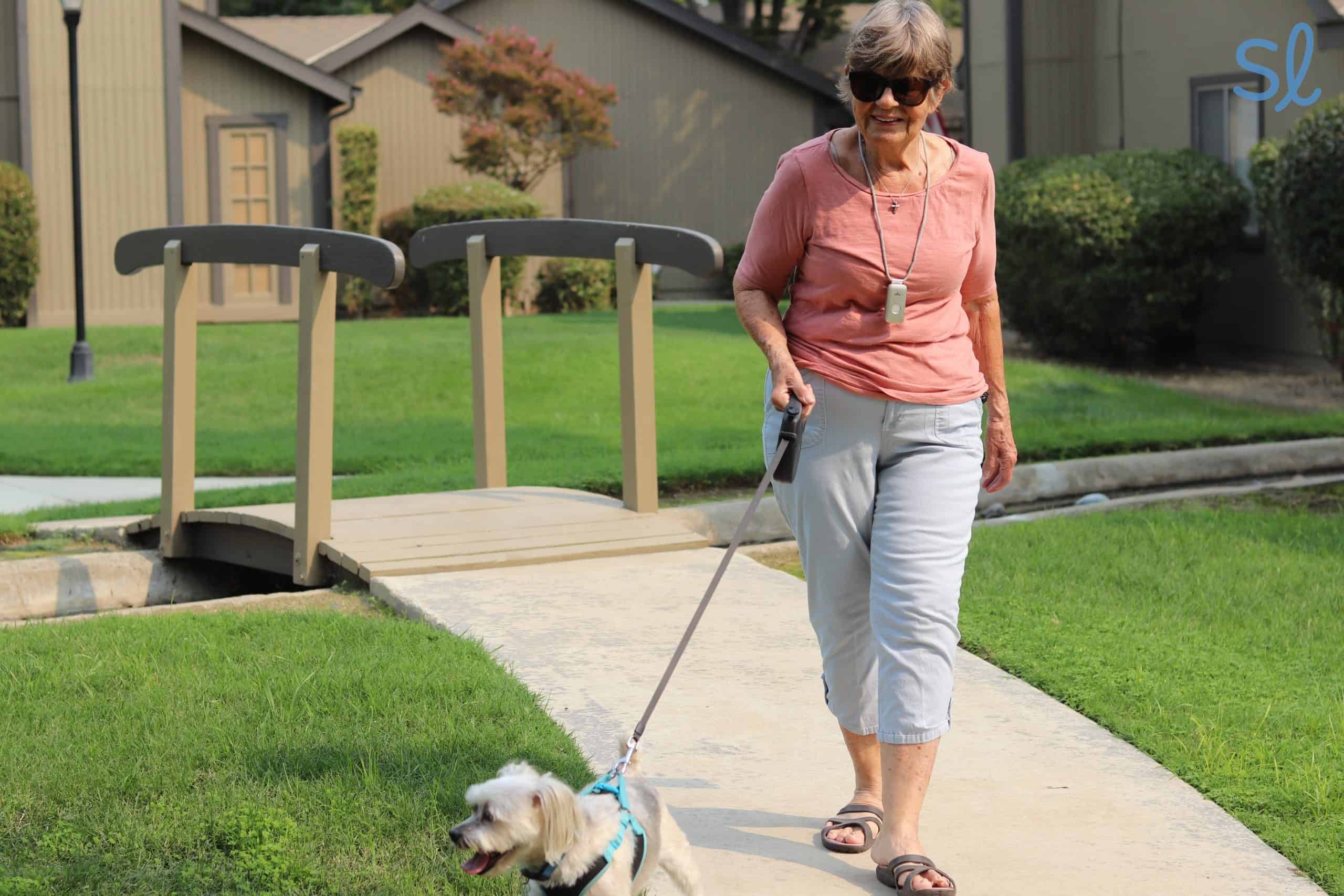 Our editor's grandma wearing her Mini Guardian system with fall detection